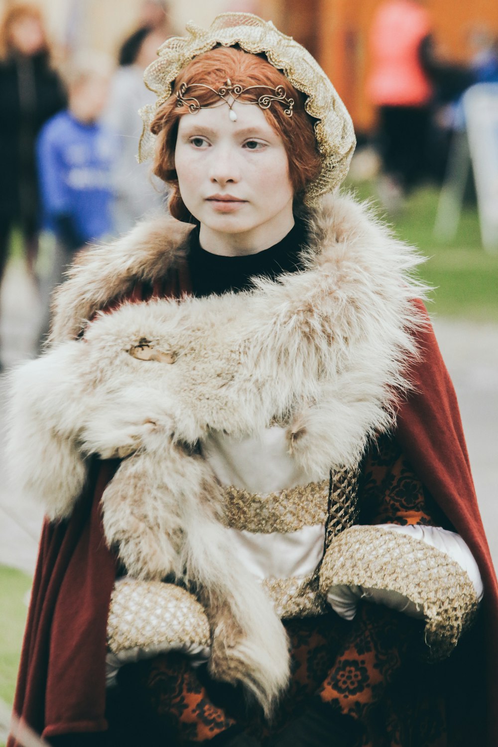 woman wearing red and white fur coat