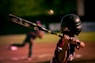 selective focus photography of person holding baseball bat