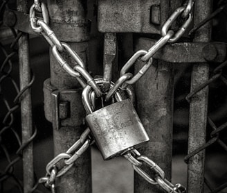 gray steel chain locked on gate