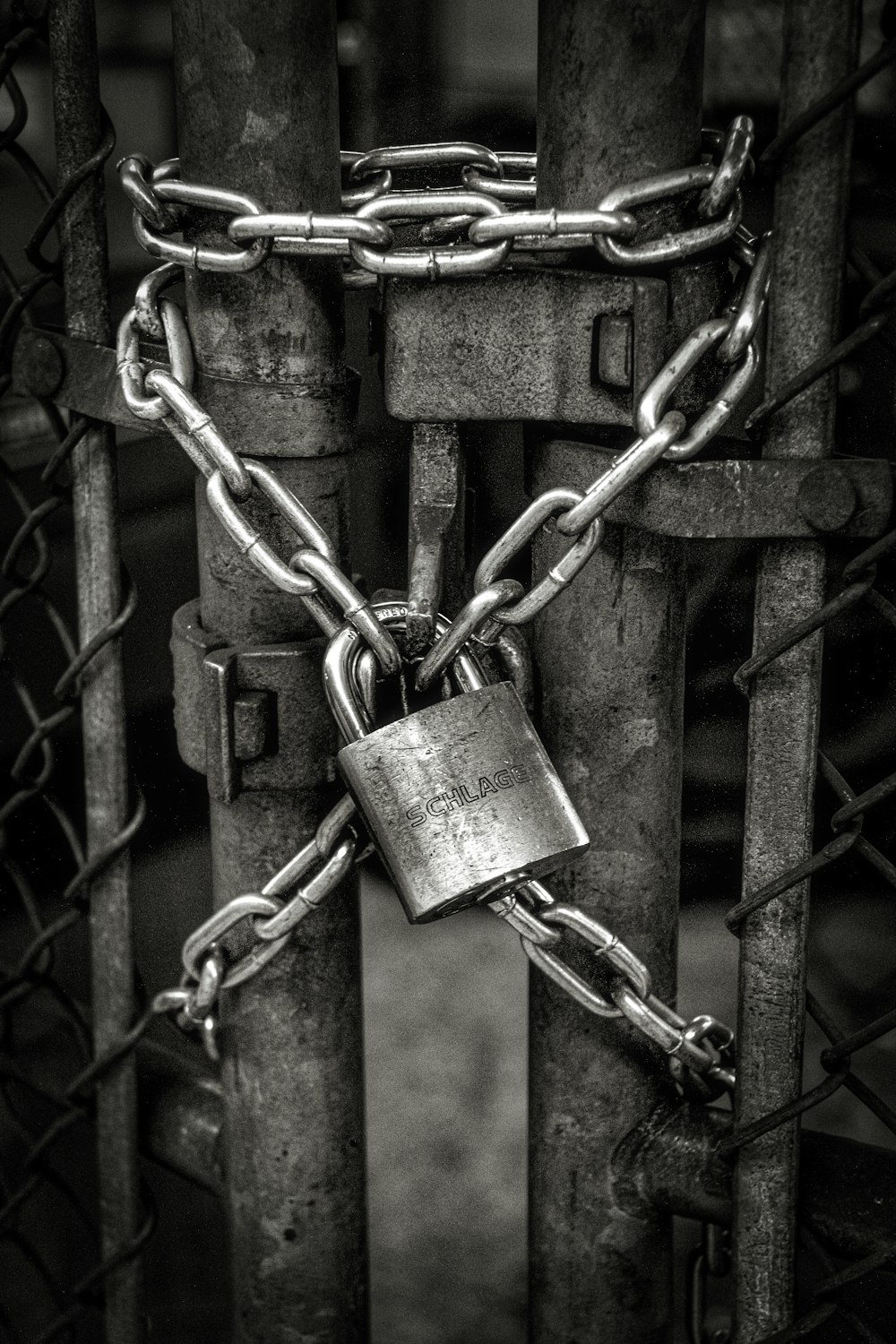 gray steel chain locked on gate