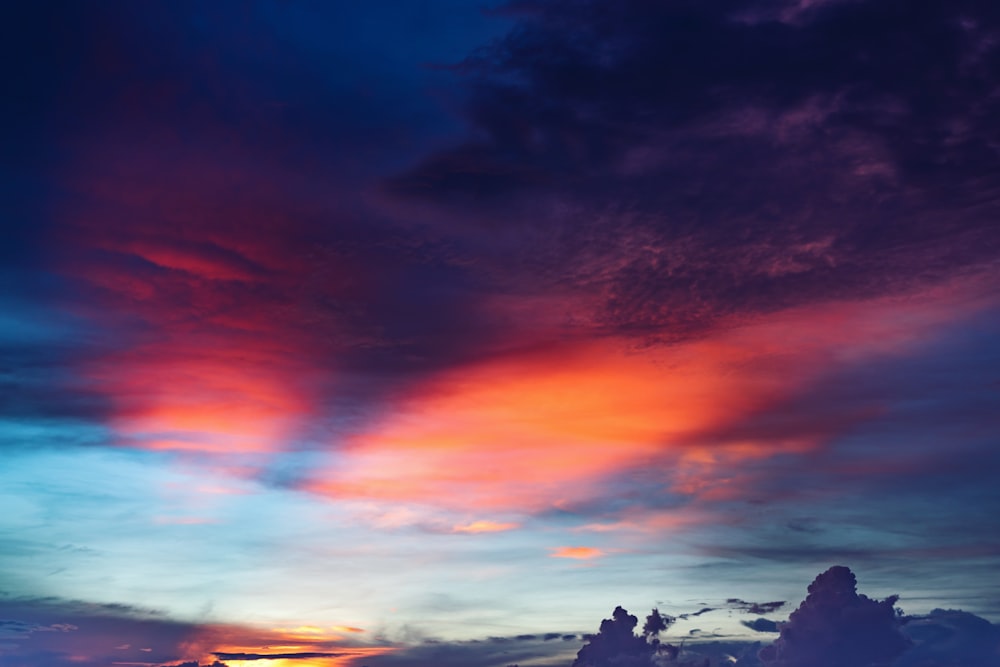 silhouette of clouds during golden hour