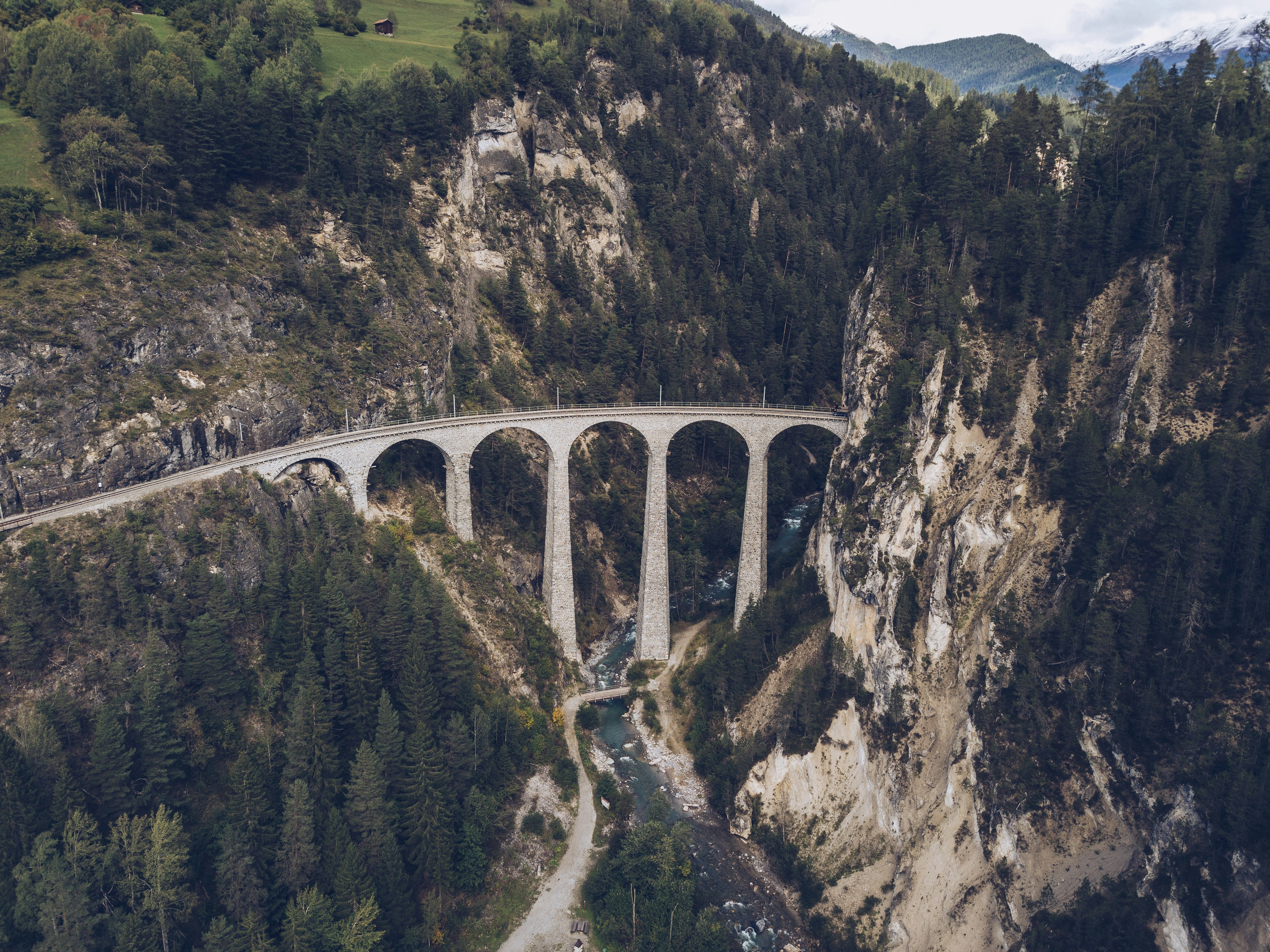 aerial view of bridge between mountains