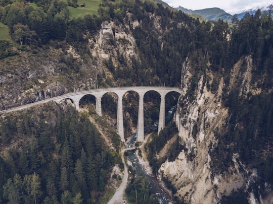 aerial view of bridge between mountains in Parc Ela Switzerland
