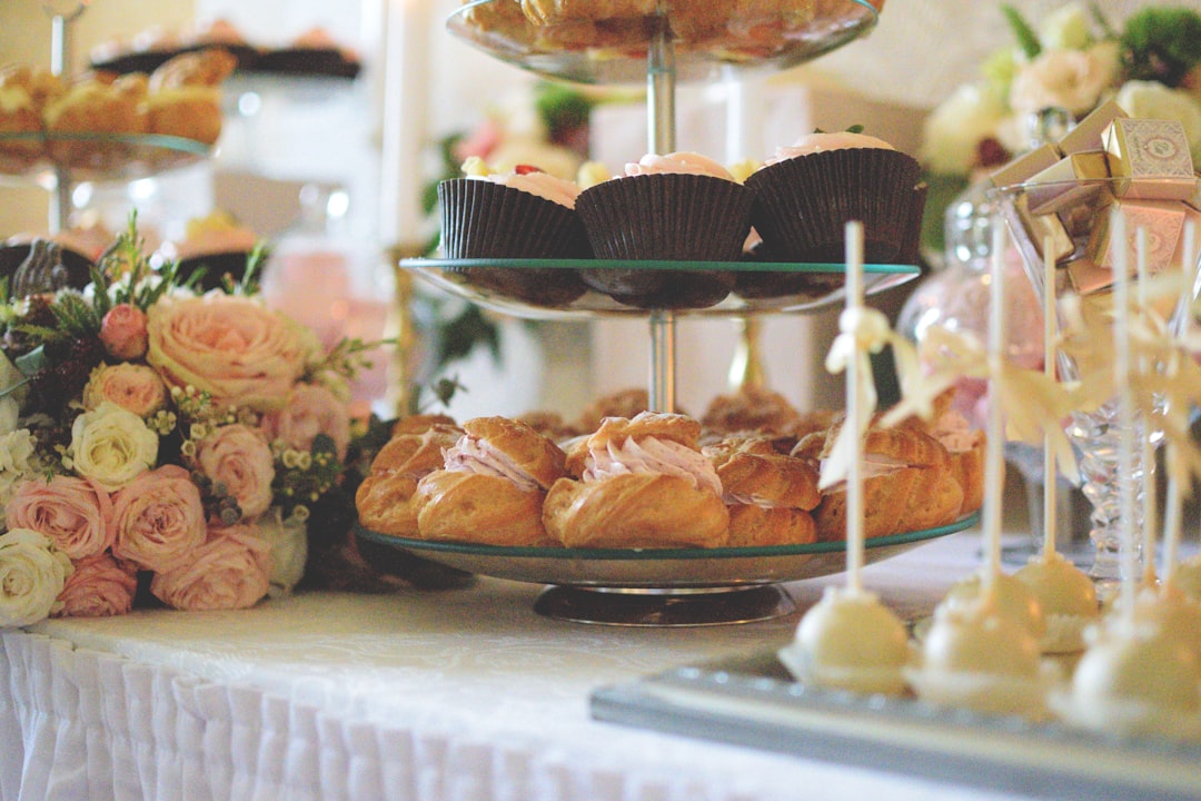assorted pastry on clear glass cupcake rack, you see a beautiful candy table from a wedding in Riga/Latvia