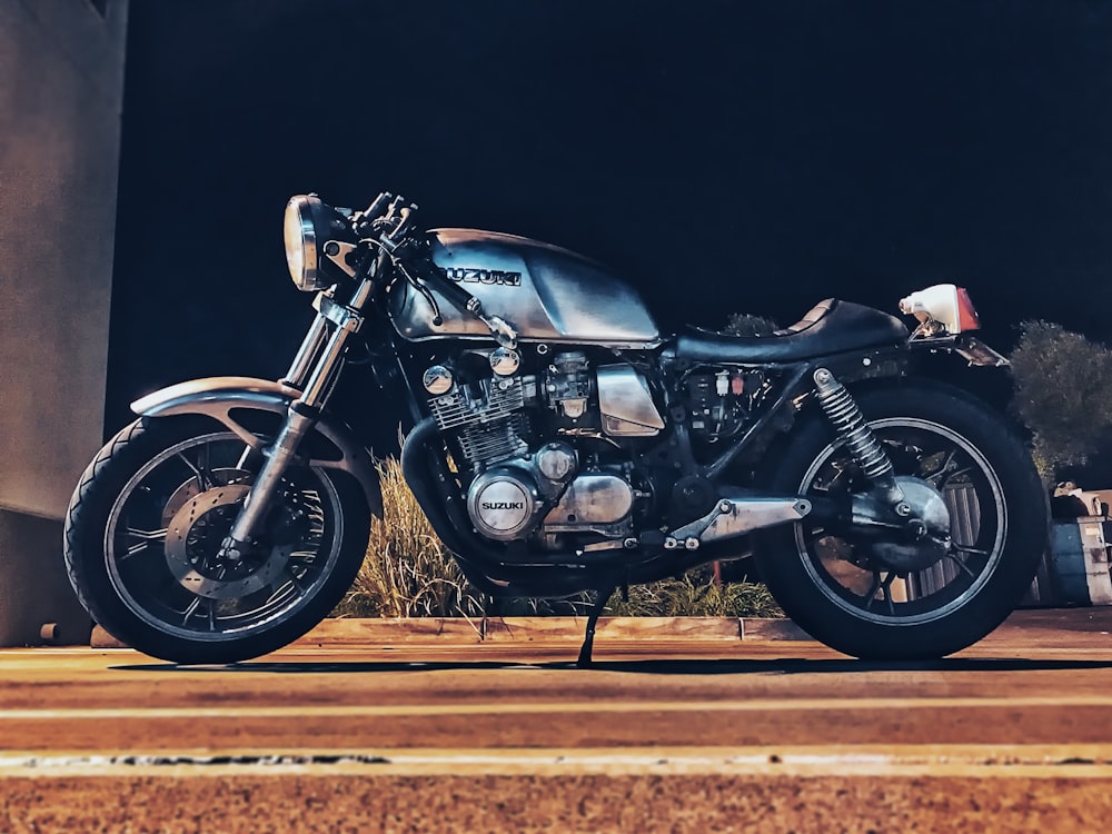 black and gray cruiser motorcycle park on road