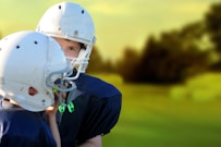 selective focus photography of two football players