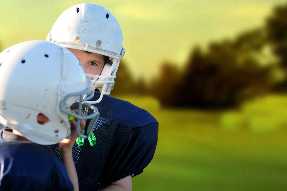 selective focus photography of two football players