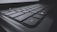 A close-up view of a black computer keyboard displaying several keys in focus, including shift, ctrl, and windows keys. The image emphasizes the texture and design of the keys with a slightly dark and moody atmosphere.