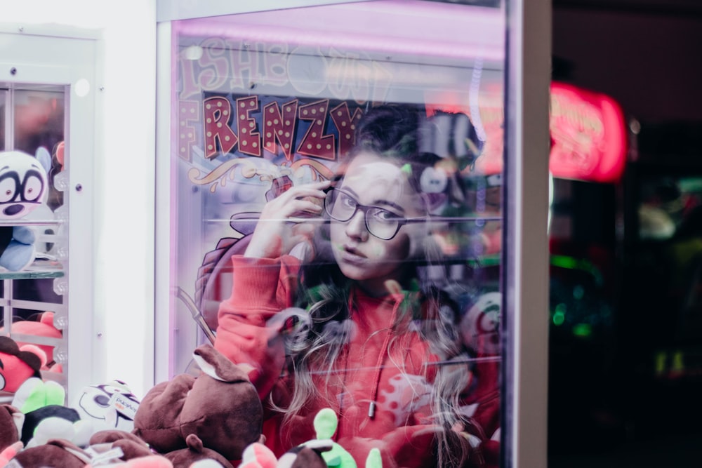 woman inside claw machine