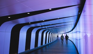 man walking through pathway