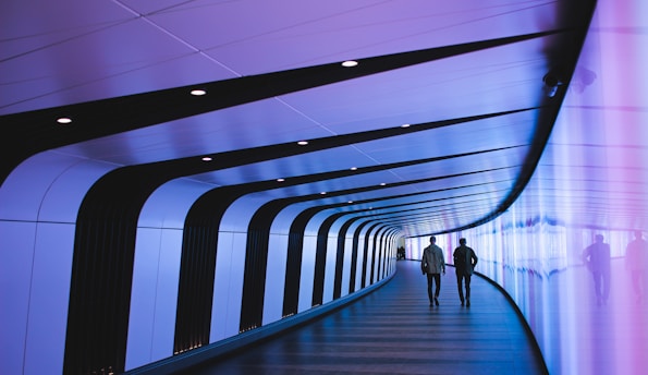 man walking through pathway