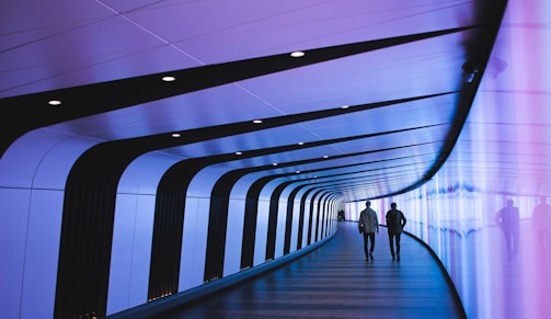 man walking through pathway