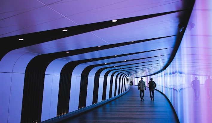 man walking through pathway