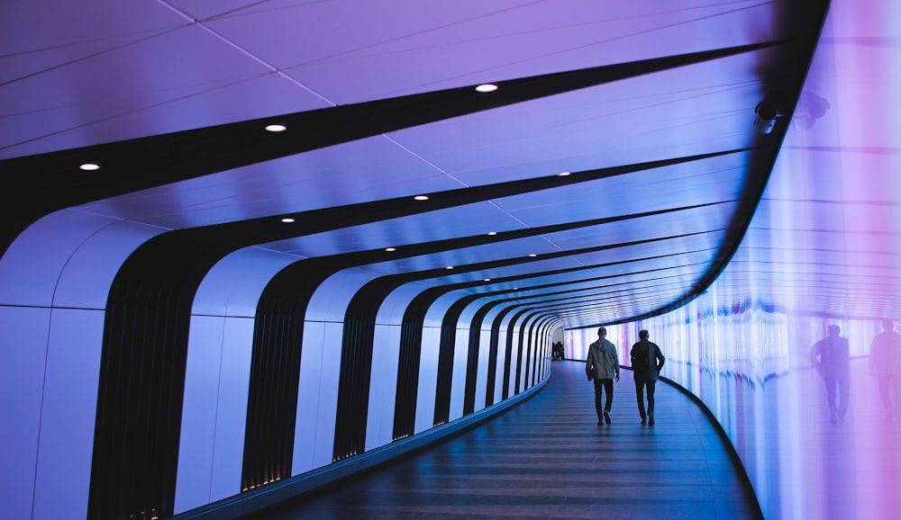 man walking through pathway