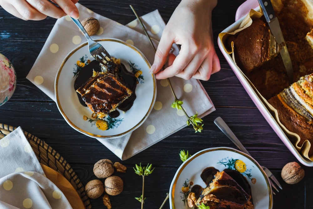 top view of person's hands using fork