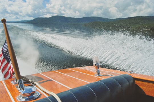 brown speedboat on top of body of water in Priest Lake United States