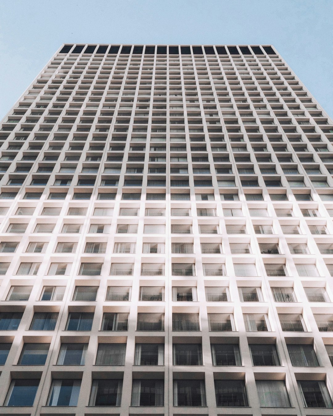 minimalist photography of white and gray high-rise building