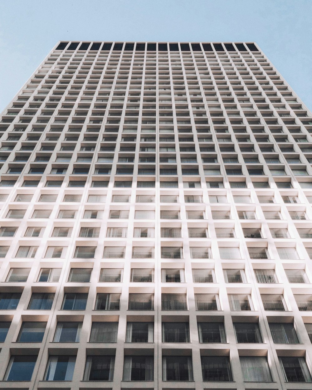 minimalist photography of white and gray high-rise building