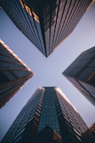 low-angle photography of four high-rise buildings