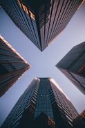low-angle photography of four high-rise buildings