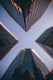 low-angle photography of four high-rise buildings