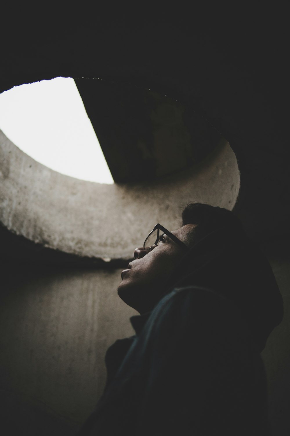 man inside hole looking up