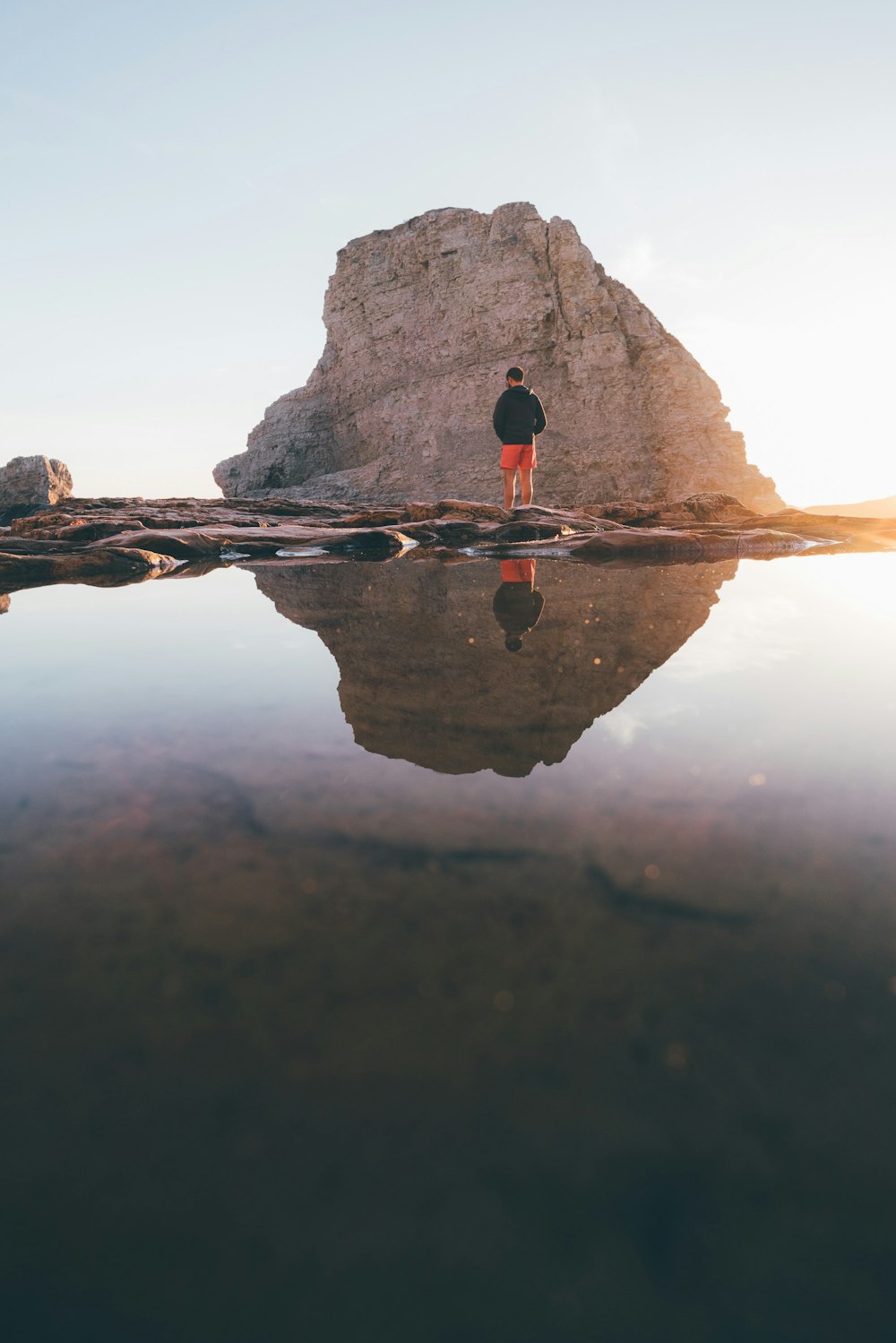 man standing on rock