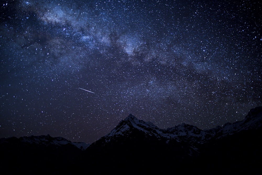 silhouette of mountain peak at nighttime