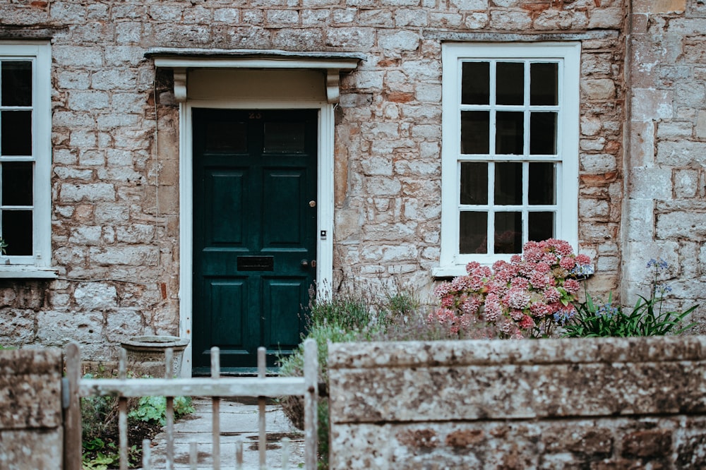 green wooden door during daytime