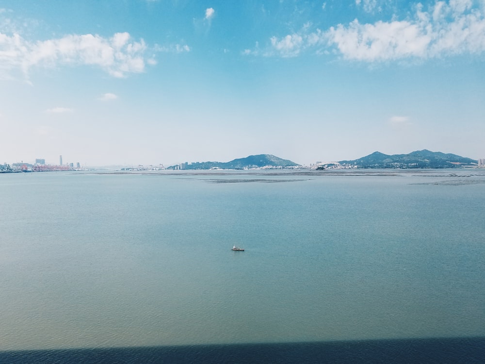 aerial photography of boat on sea during daytime