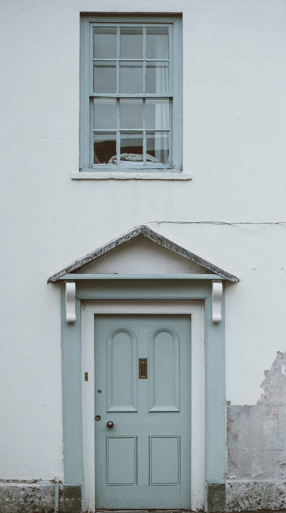 gray wooden 4-paneled door