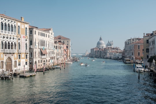 boats running on sea between buildings in Gallerie dell'Accademia Italy