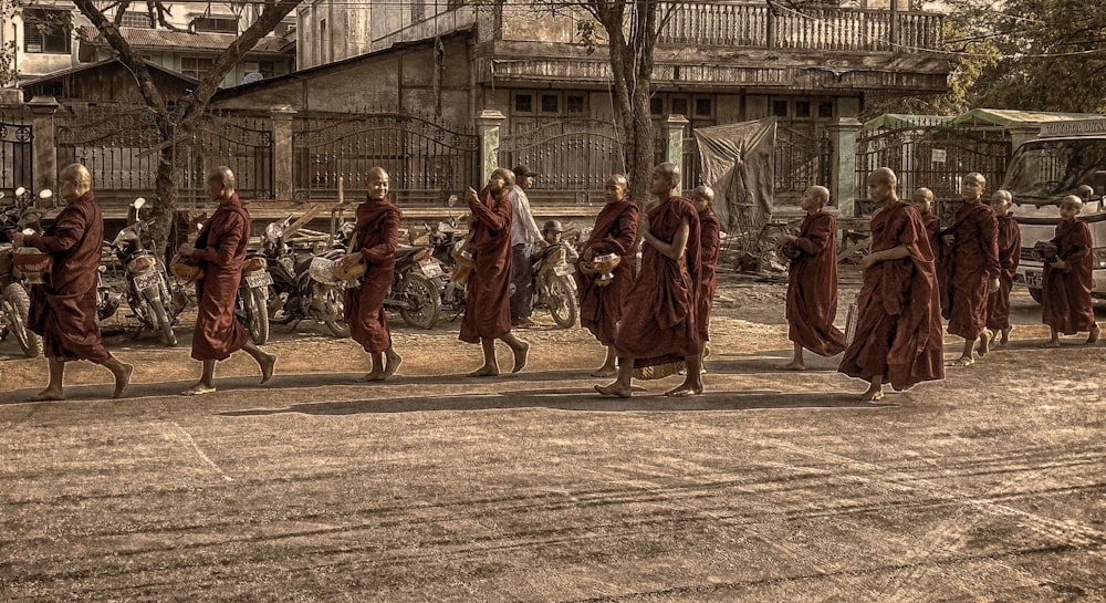 monks marching on street