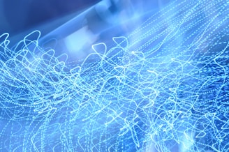 Abstract visualization of energetic codes and vibrational patterns in blue hues.