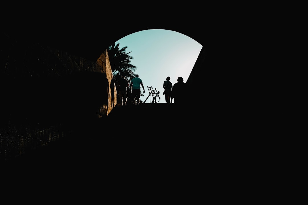 silhouette of man riding bicycle,