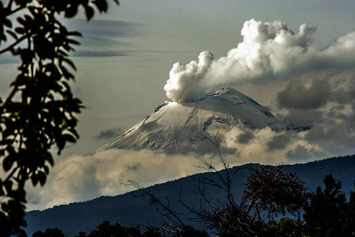 time lapse photography of mountain with smoke on its mouth