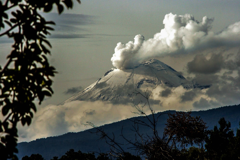 time lapse photography of mountain with smoke on its mouth