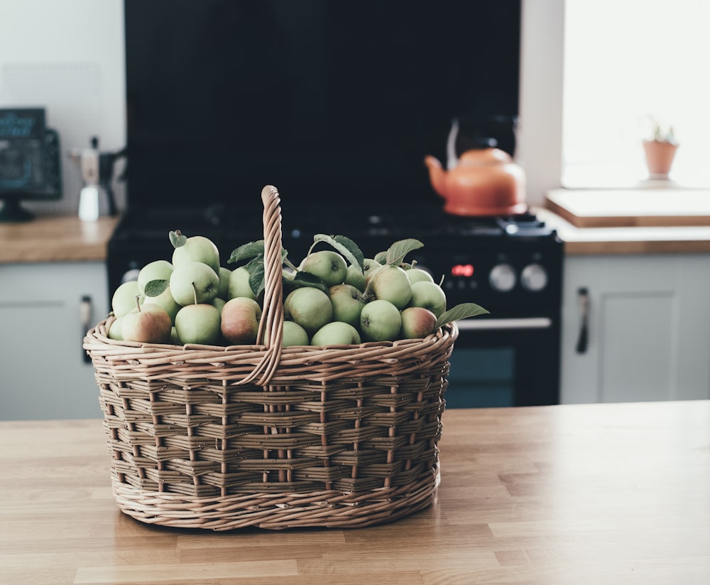 basket of apple in brown panel