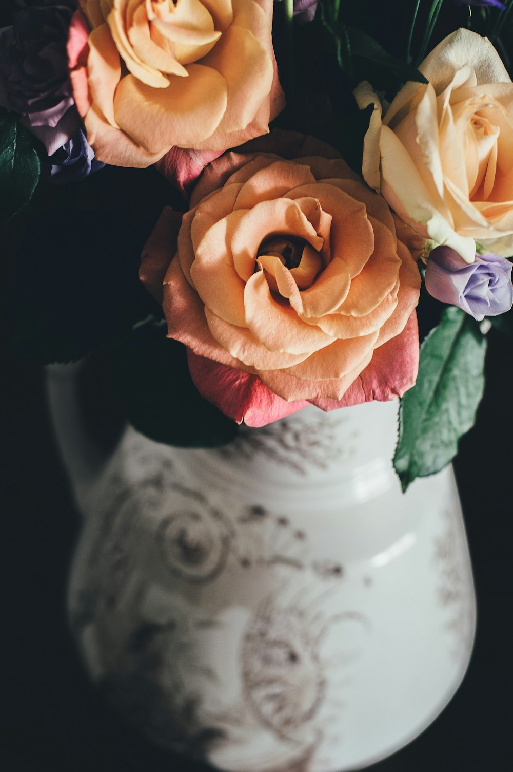 closeup photo of beige rose flower arrangement
