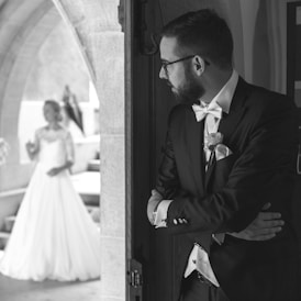 man looking at his bride