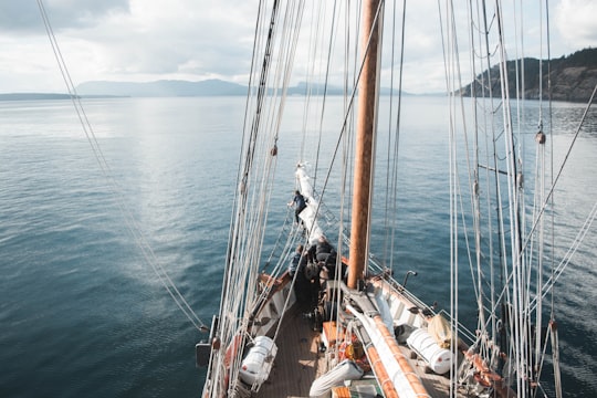 white and brown boat sailing on body of water in Gulf Islands Canada