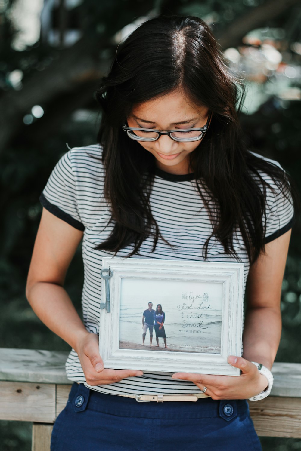 woman holding photo frame