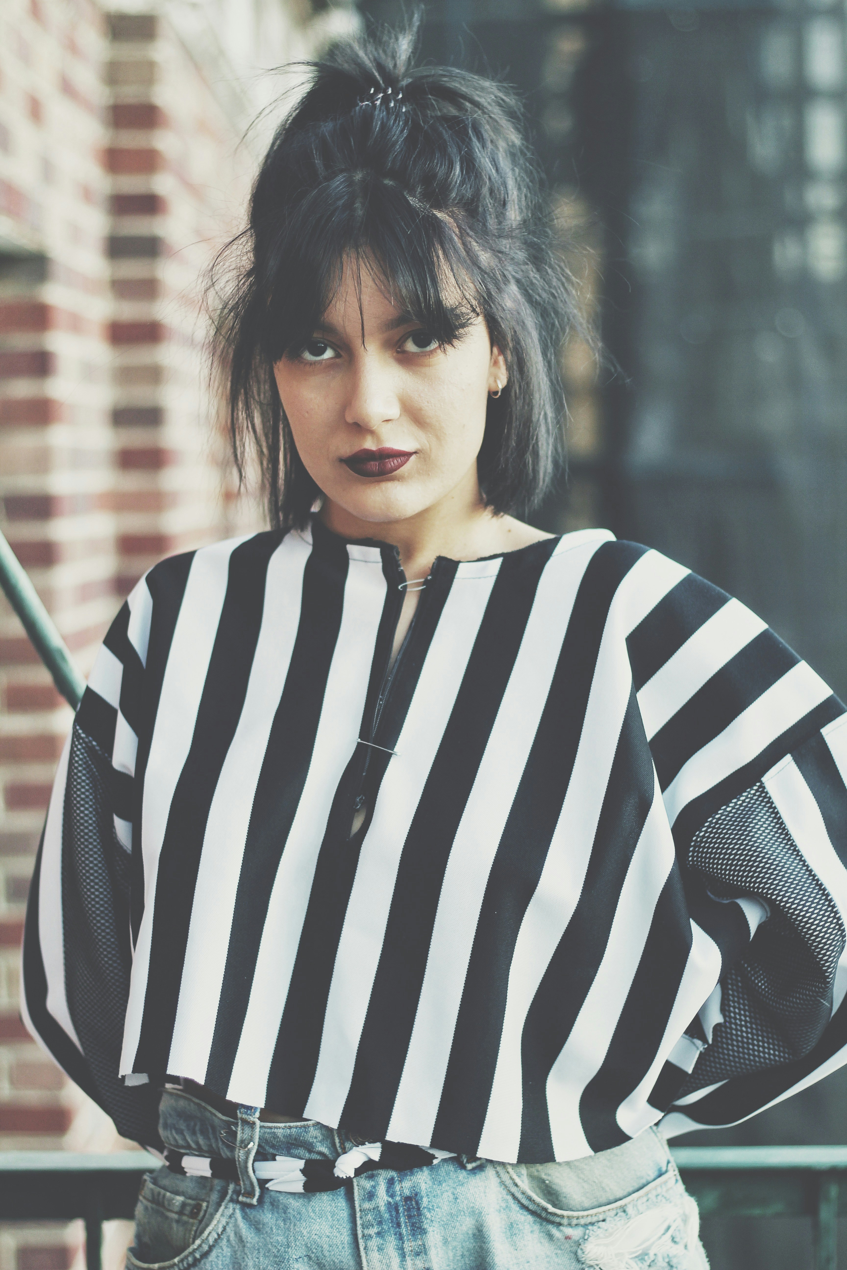 woman standing besides the fence