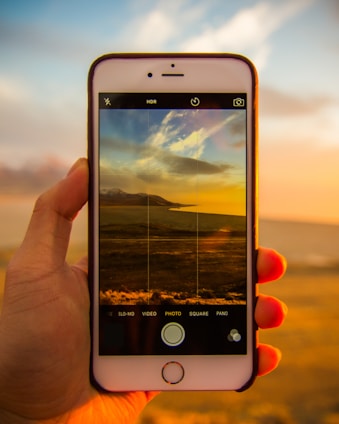A vibrant smartphone screen displaying the PNW Travel app interface with flight options and scenic Pacific Northwest landscapes in the background.