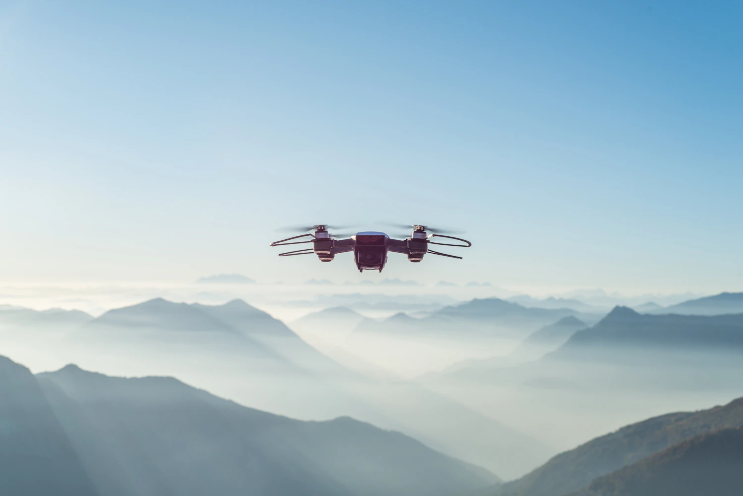 Aeron camera drone flying over mountains