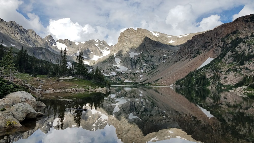 landscape photo of river between mountains