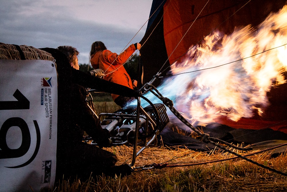 two man preparing hot air balloon