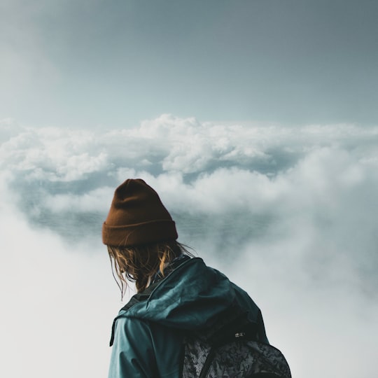 person looking at clouds in Mount Taranaki New Zealand