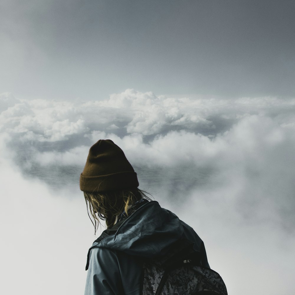 person looking at clouds