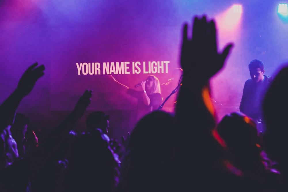 silhouette of crowd in front of state with your name is light text overlay